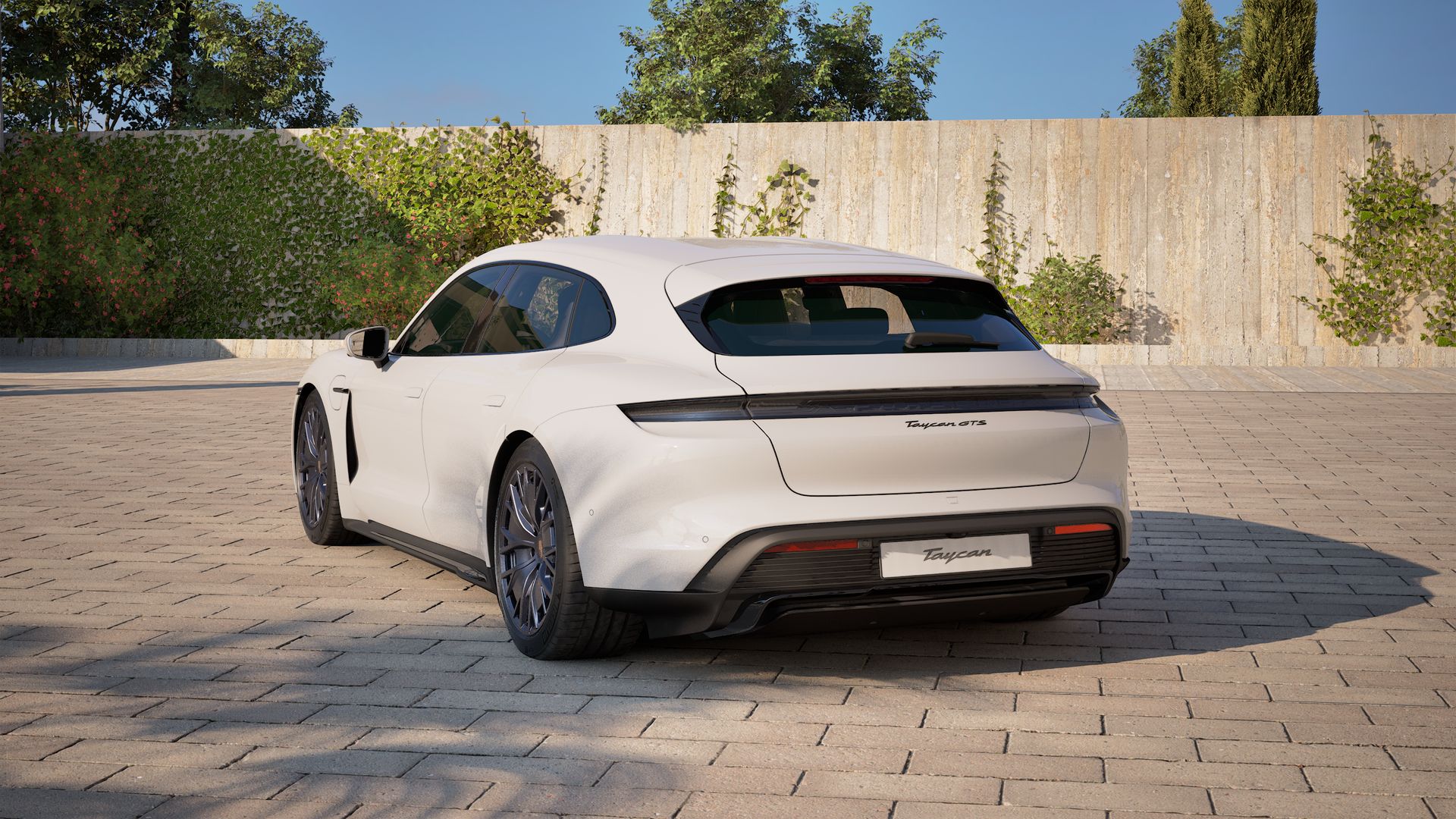 Außenansicht von Taycan GTS Sport Turismo mit der Rückseite und der linken Seite des Fahrzeugs