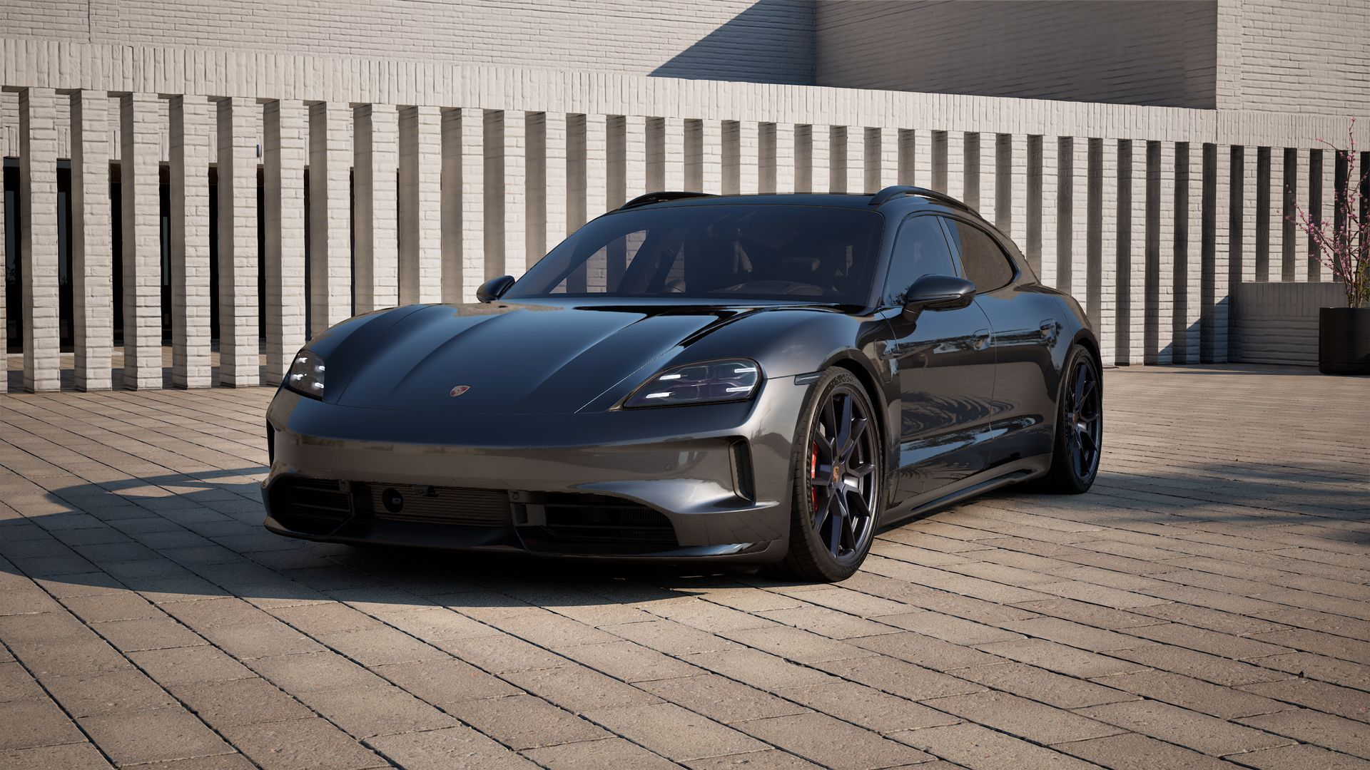 Außenansicht von Taycan GTS Sport Turismo mit der Vorderseite und der linken Seite des Fahrzeugs