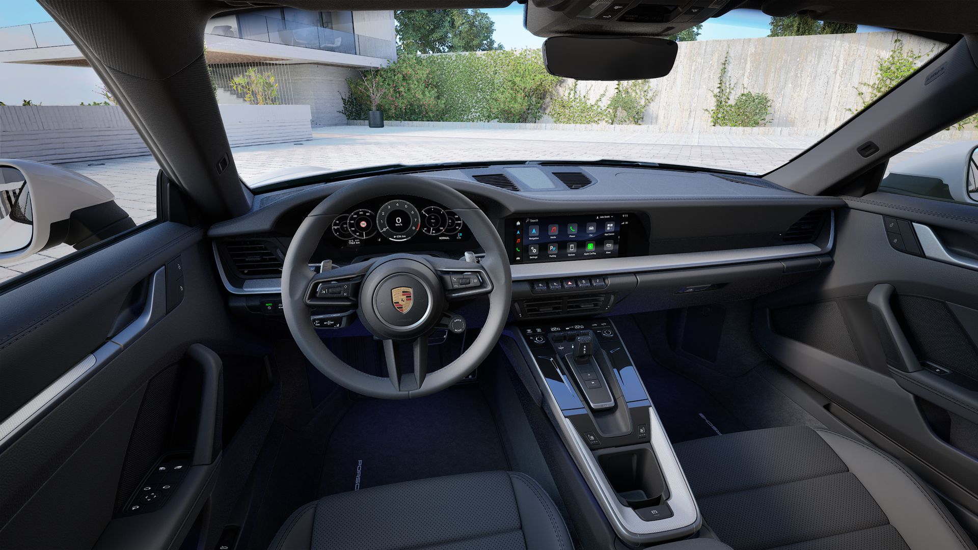 Interior view showing the steering wheel and dashboard of 911 Carrera