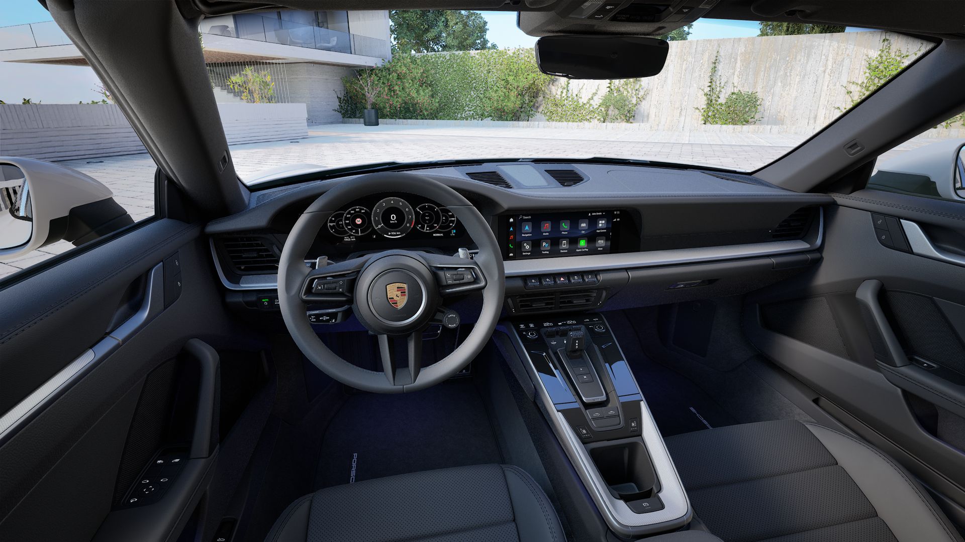 Interior view showing the steering wheel and dashboard of 911 Targa 4S