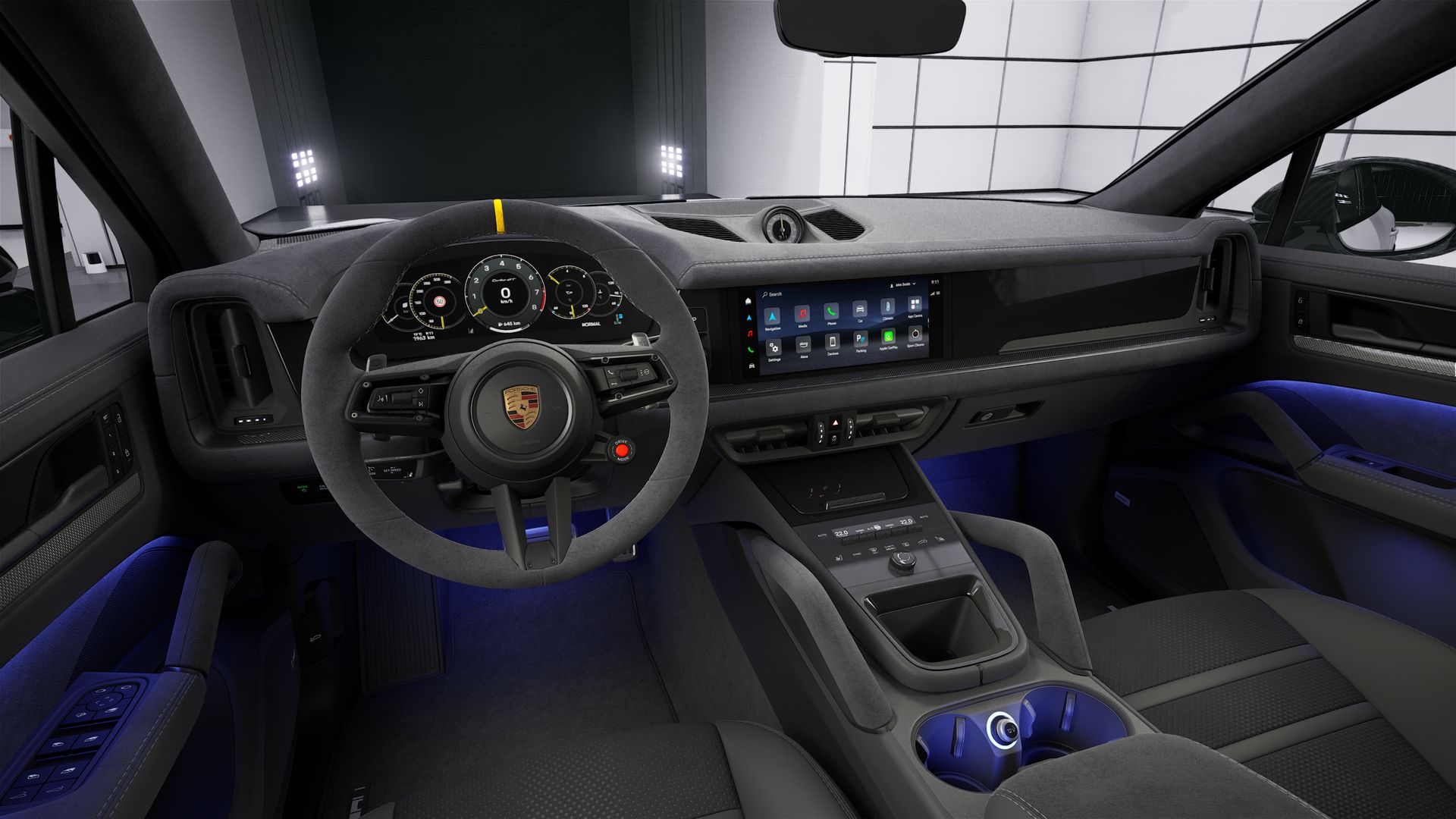 Interior view showing the steering wheel and dashboard of Cayenne Turbo GT