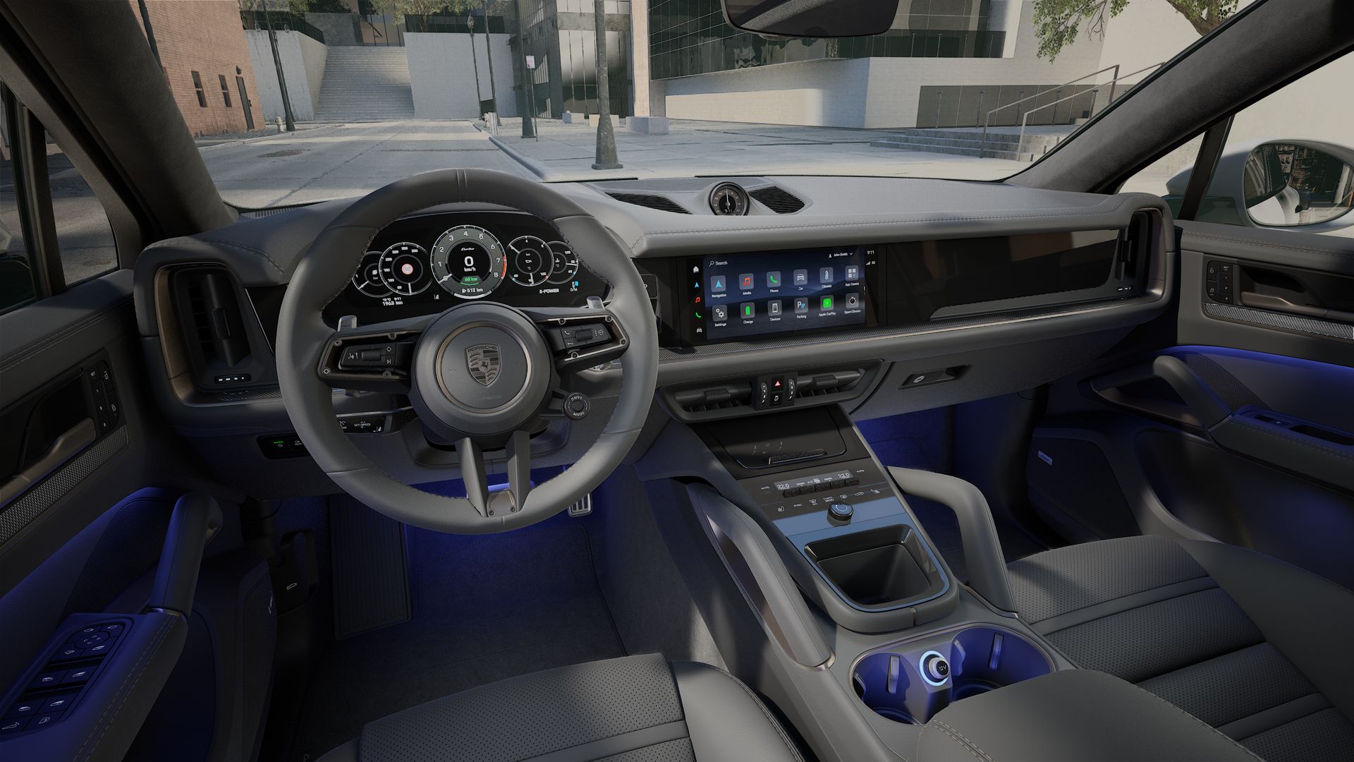 Interior view showing the steering wheel and dashboard of Cayenne Turbo E-Hybrid Coupe