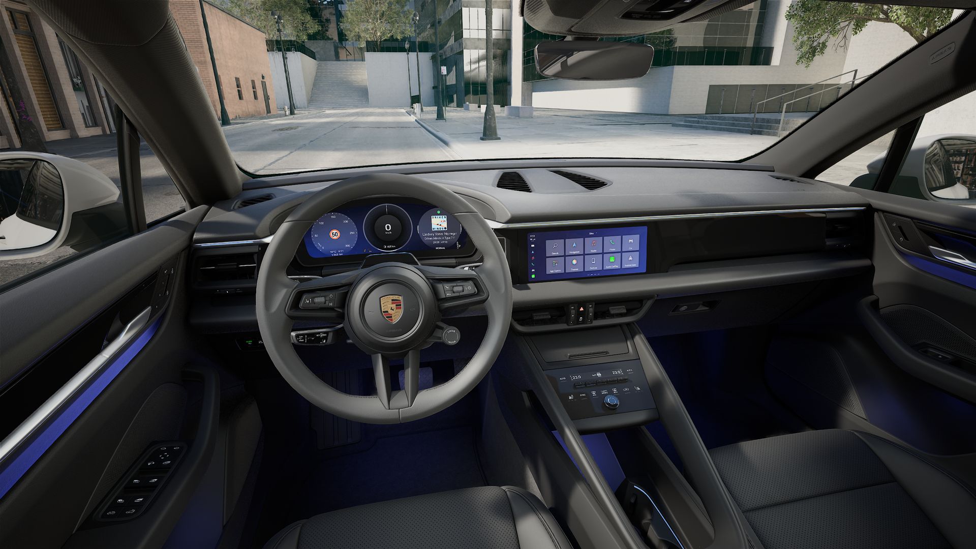 Interior view showing the steering wheel and dashboard of Macan Electric