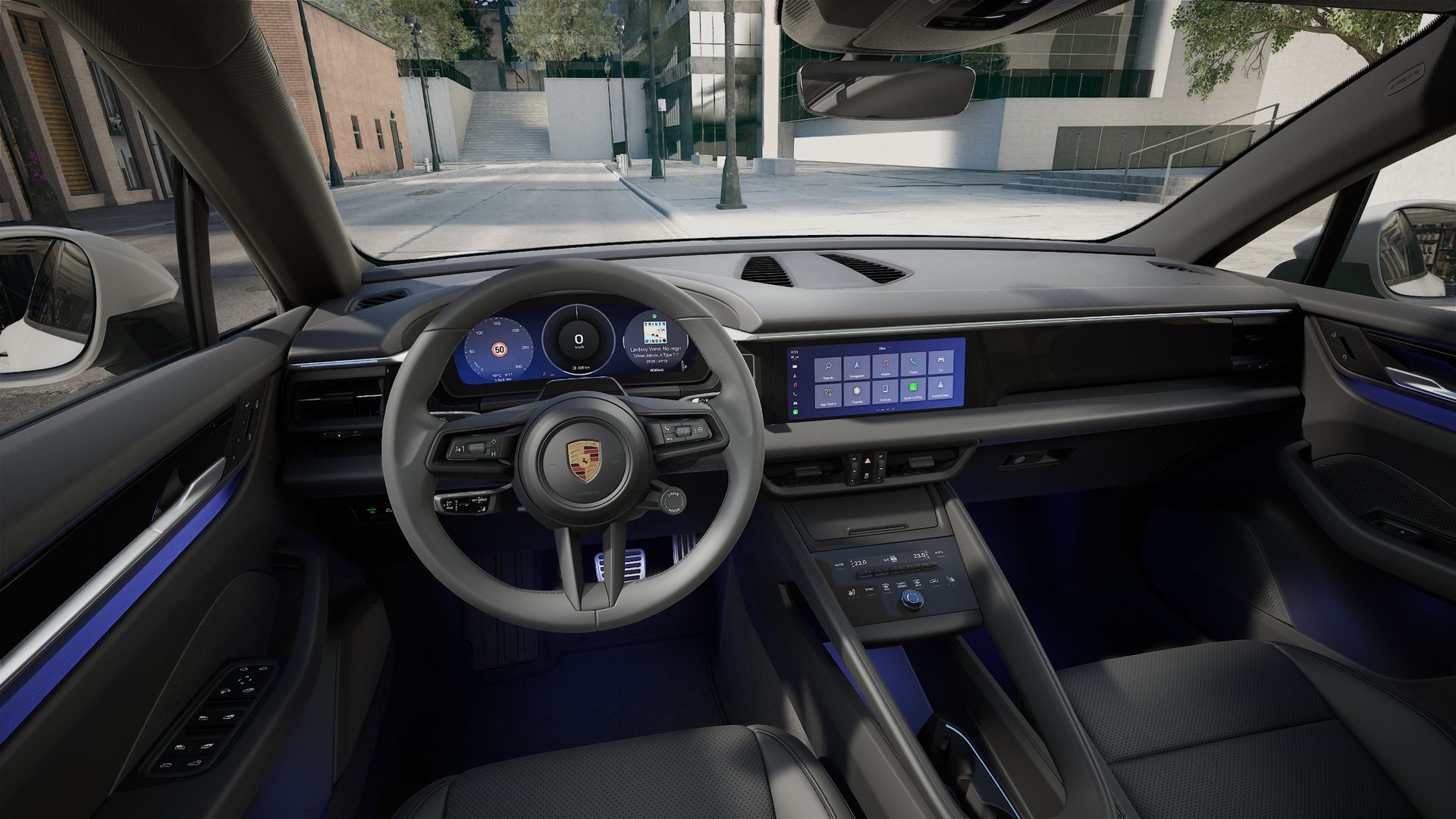Interior view showing the steering wheel and dashboard of Macan 4S Electric
