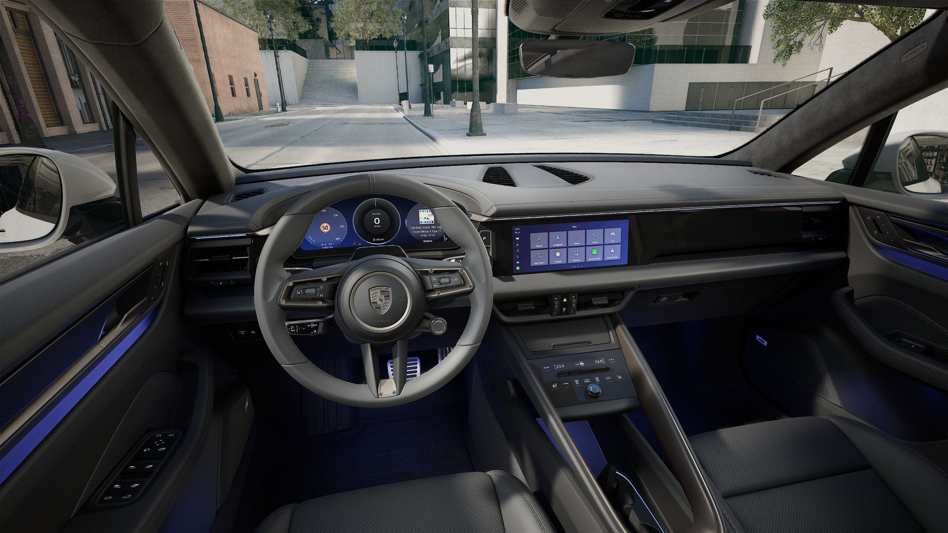 Interior view showing the steering wheel and dashboard of Macan Turbo Electric