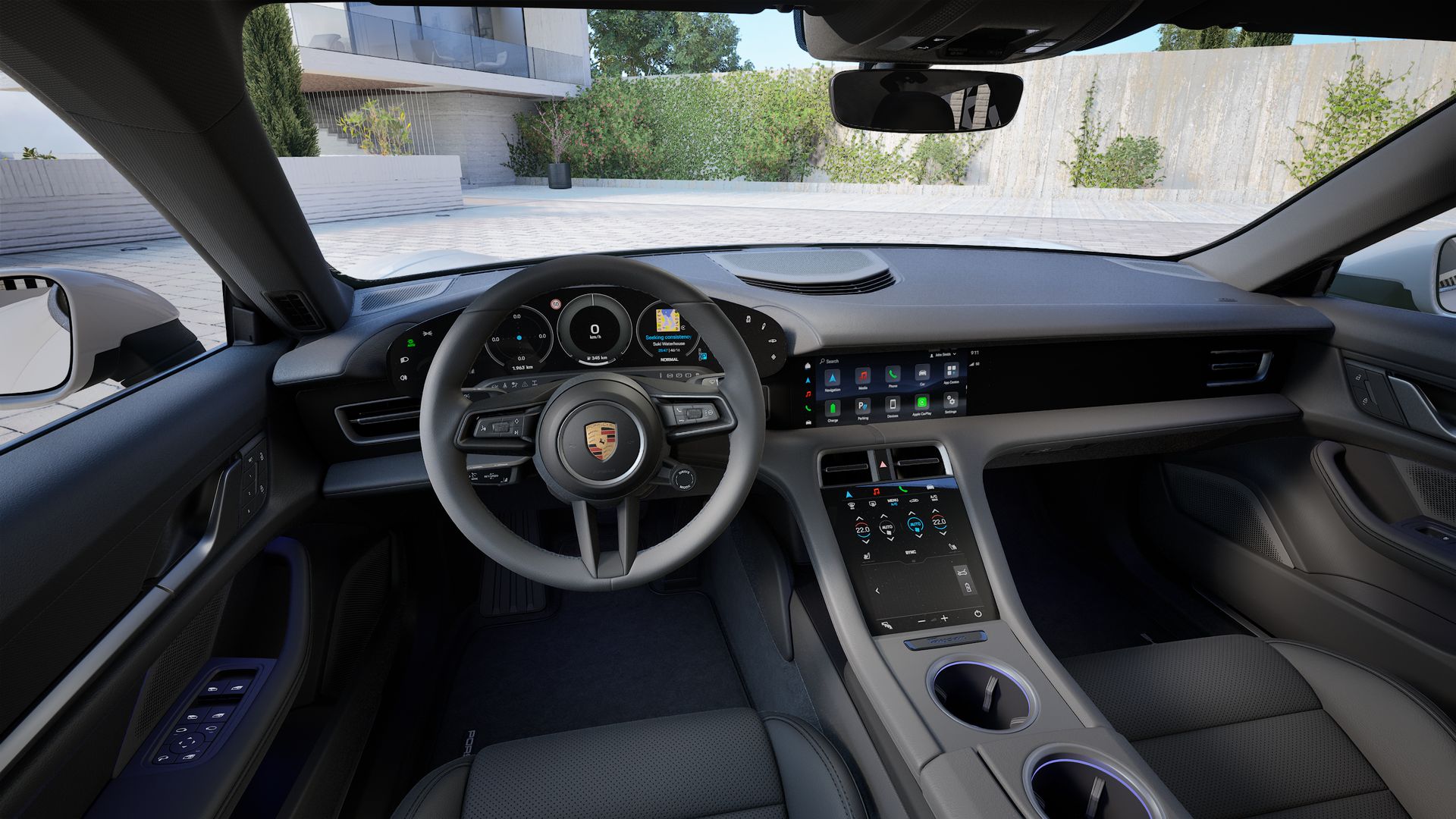 Interior view showing the steering wheel and dashboard of Taycan 4S