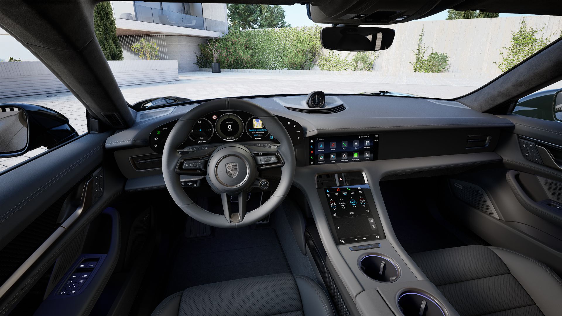 Interior view showing the steering wheel and dashboard of Taycan Turbo S