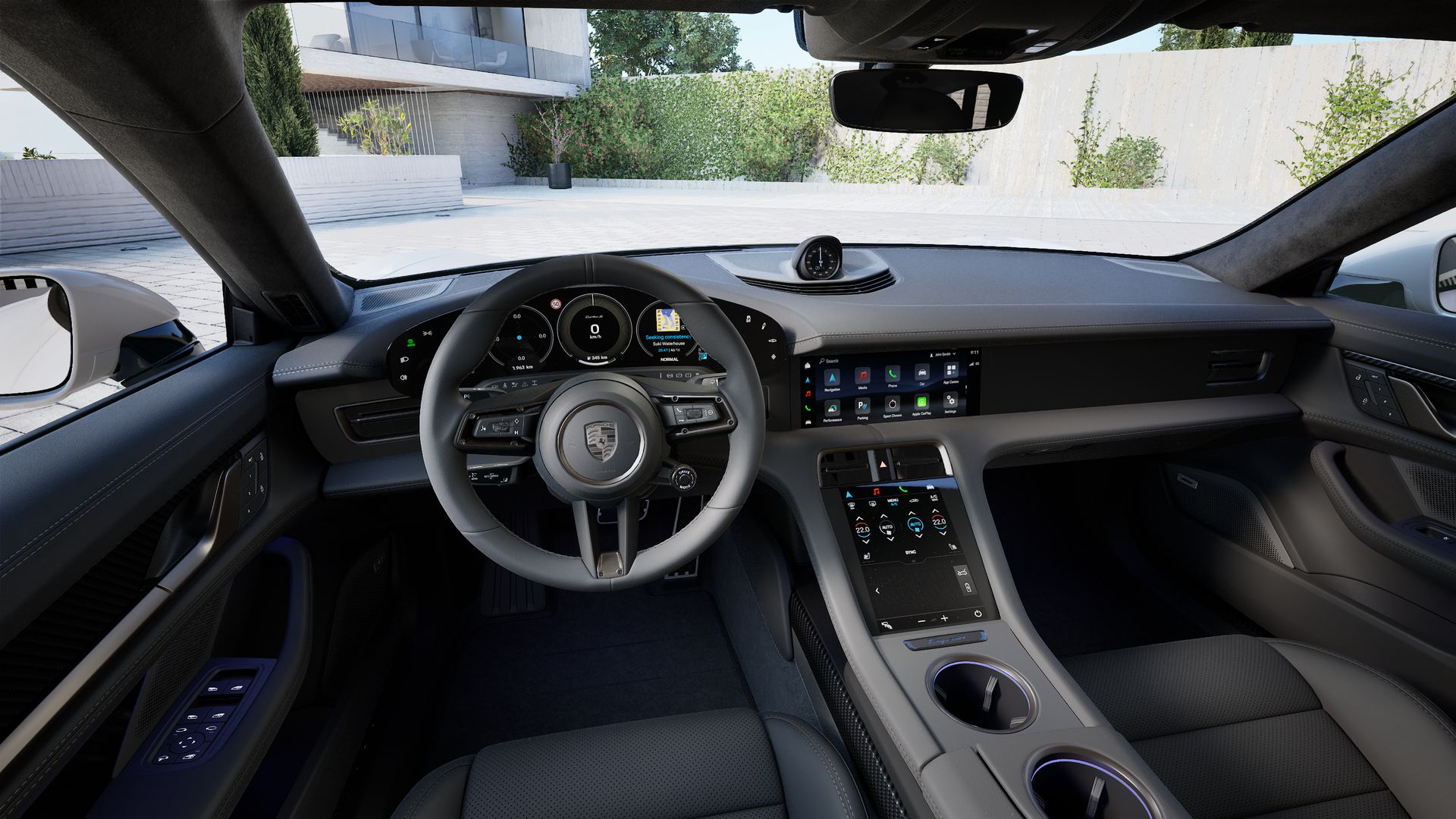 Interior view showing the steering wheel and dashboard of Taycan Turbo S