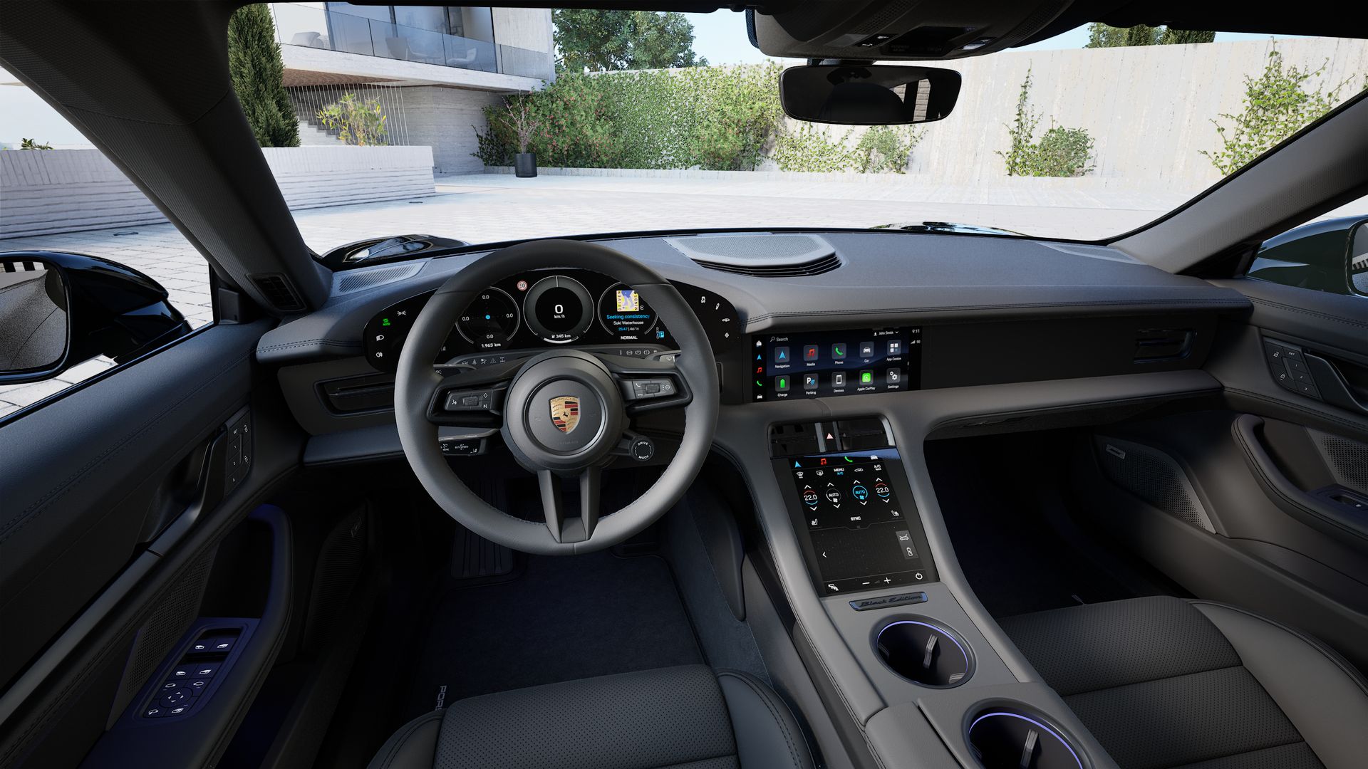 Interior view showing the steering wheel and dashboard of Taycan 4 Black Edition