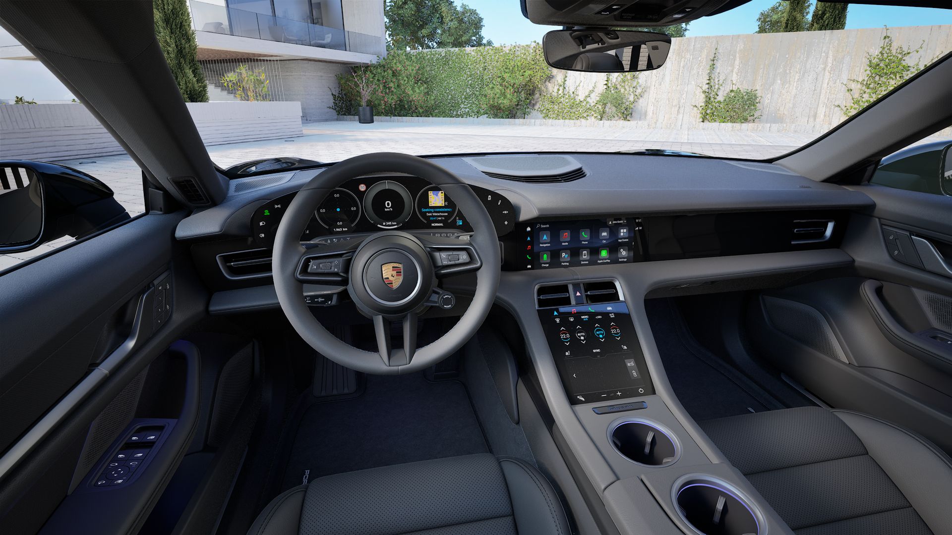Interior view showing the steering wheel and dashboard of Taycan 4 Cross Turismo
