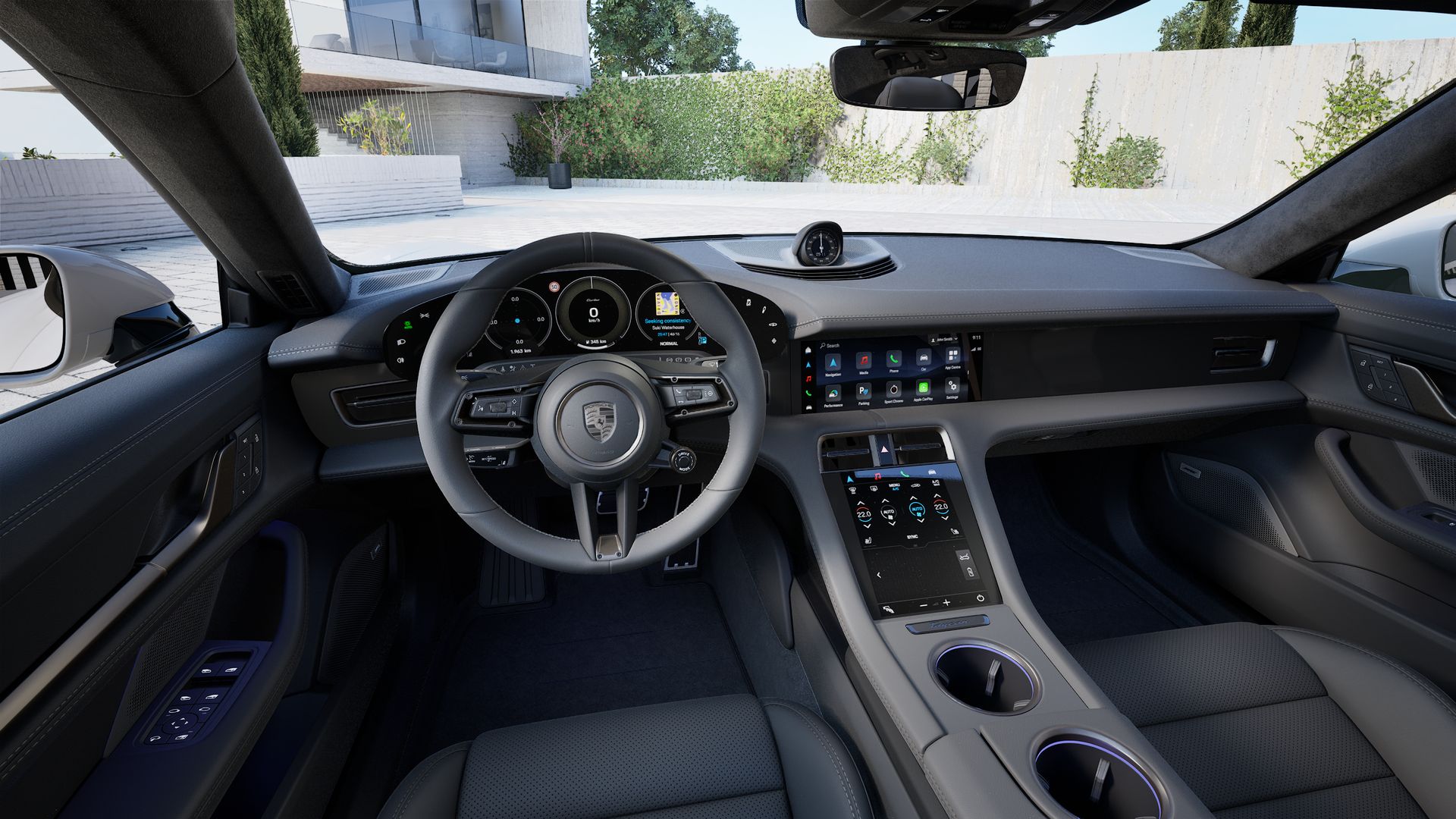 Interior view showing the steering wheel and dashboard of Taycan Turbo Cross Turismo