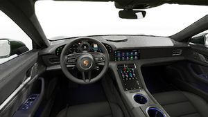 Interior view showing the steering wheel and dashboard of Taycan 4S