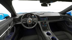 Interior view showing the steering wheel and dashboard of Taycan 4S