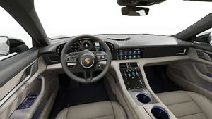 Interior view showing the steering wheel and dashboard of Taycan 4 Cross Turismo