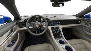 Interior view showing the steering wheel and dashboard of Taycan 4 Cross Turismo