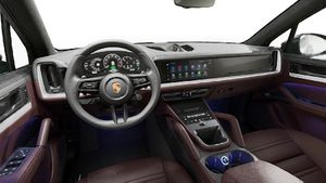 Vista interna che mostra il volante e il cruscotto di Cayenne E-Hybrid