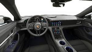 Vista interna che mostra il volante e il cruscotto di Taycan 4 Cross Turismo