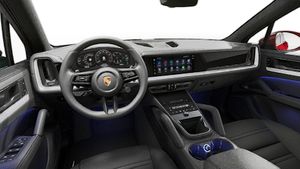 Interior view showing the steering wheel and dashboard of Cayenne Passion