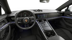 Interior view showing the steering wheel and dashboard of Panamera 4 E-Hybrid