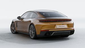 Exterior view of Panamera Turbo E-Hybrid showing the back and left side of the car