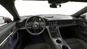 Vista interior, mostrando o volante e o painel de instrumentos de Taycan