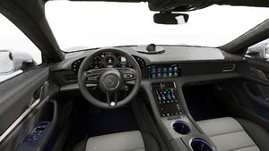 Vista interior, mostrando o volante e o painel de instrumentos de Taycan Turbo