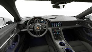 Vista interior, mostrando o volante e o painel de instrumentos de Taycan Sport Turismo