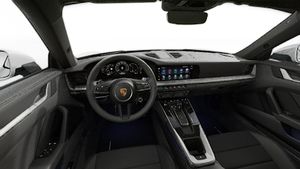 Interior view showing the steering wheel and dashboard of 911 Carrera