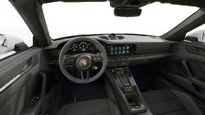 Interior view showing the steering wheel and dashboard of 911 Carrera GTS Cabriolet