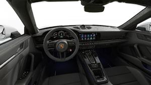 Interior view showing the steering wheel and dashboard of 911 Carrera GTS Cabriolet