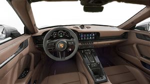 Interior view showing the steering wheel and dashboard of 911 Carrera GTS Cabriolet