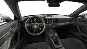 Interior view showing the steering wheel and dashboard of 911 Spirit 70