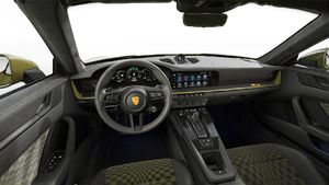 Interior view showing the steering wheel and dashboard of 911 Spirit 70