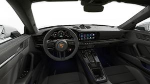 Interior view showing the steering wheel and dashboard of 911 Carrera 4 GTS