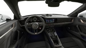 Interior view showing the steering wheel and dashboard of 911 Turbo S