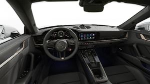 Interior view showing the steering wheel and dashboard of 911 Turbo S