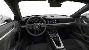 Interior view showing the steering wheel and dashboard of 911 Carrera 4S
