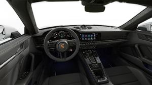 Interior view showing the steering wheel and dashboard of 911 Carrera 4 GTS Cabriolet