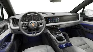 Interior view showing the steering wheel and dashboard of Cayenne