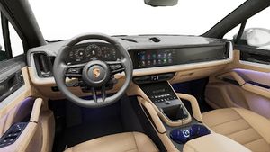 Interior view showing the steering wheel and dashboard of Cayenne
