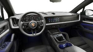 Interior view showing the steering wheel and dashboard of Cayenne