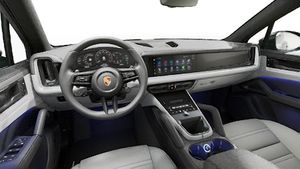 Interior view showing the steering wheel and dashboard of Cayenne