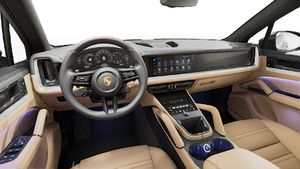 Interior view showing the steering wheel and dashboard of Cayenne