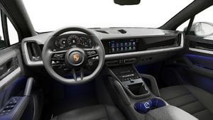 Interior view showing the steering wheel and dashboard of Cayenne