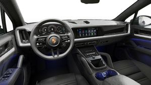Interior view showing the steering wheel and dashboard of Cayenne