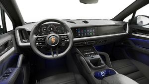 Interior view showing the steering wheel and dashboard of Cayenne
