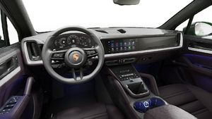 Interior view showing the steering wheel and dashboard of Cayenne