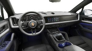 Interior view showing the steering wheel and dashboard of Cayenne