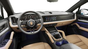 Interior view showing the steering wheel and dashboard of Cayenne