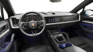 Interior view showing the steering wheel and dashboard of Cayenne